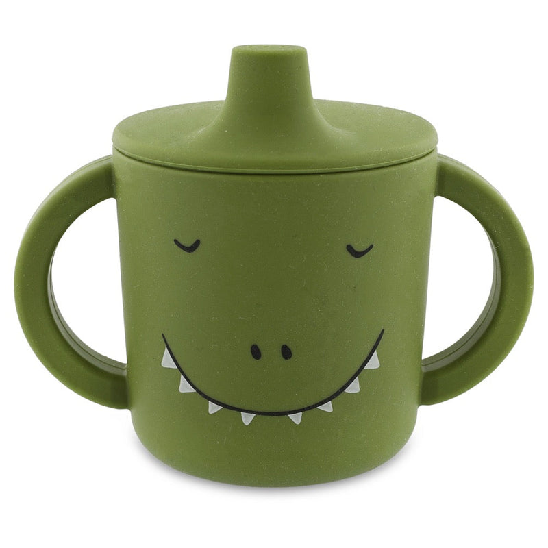 Green silicone sippy cup with dinosaur face and big handles for easy grip and spill-proof drinking