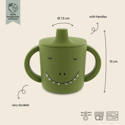 Green silicone sippy cup with dinosaur face and big handles for toddlers aged 4 months and up