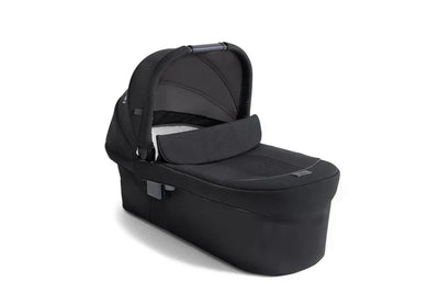 Joie Finiti Ramble XL carry cot in black with water-repellent canopy and luxury leatherette handle.