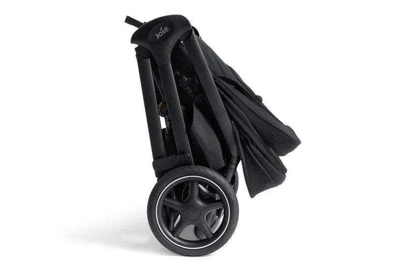 Folded black Joie Finiti 4-in-1 pram with large puncture-proof wheels and compact design for easy travel.