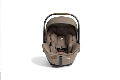 Joie Finiti Flex infant car seat in maple brown color with cushioned interior and adjustable handle