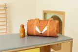 Trixie Bottle 350ml stainless steel water bottle with Mr. Fox design and carry loop on a table next to an orange bag